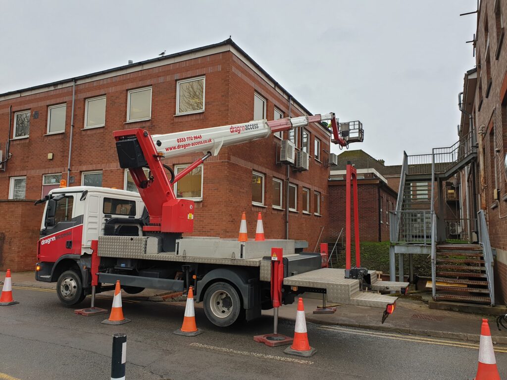 ruck-mounted lift used for gutter or building maintenance